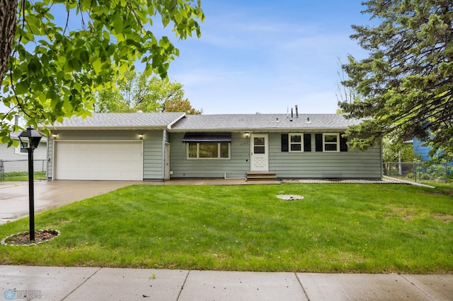 2207 16th St S, Fargo, ND 58103 - single story home with a garage, driveway, and a shingled roof