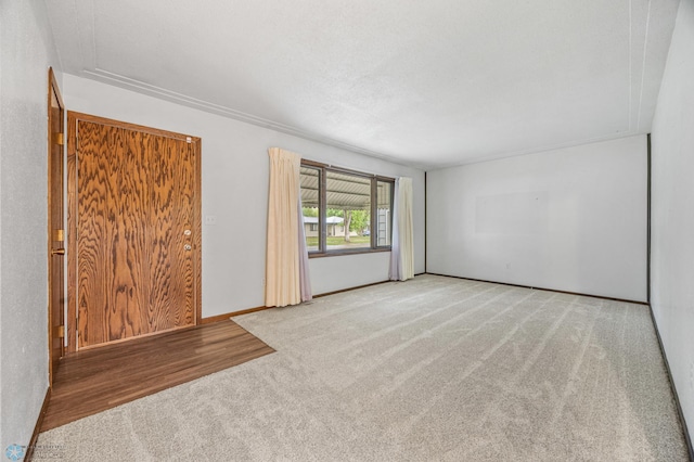 2207 16th St S, Fargo, ND 58103 - carpeted spare room featuring baseboards