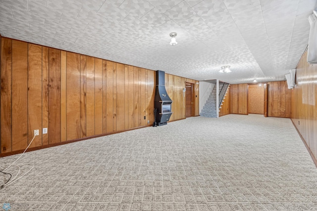 2207 16th St S, Fargo, ND 58103 - finished basement with carpet floors, stairs, and wooden walls