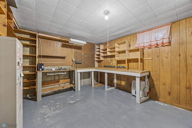 2207 16th St S, Fargo, ND 58103 - basement featuring a workshop area and wood walls