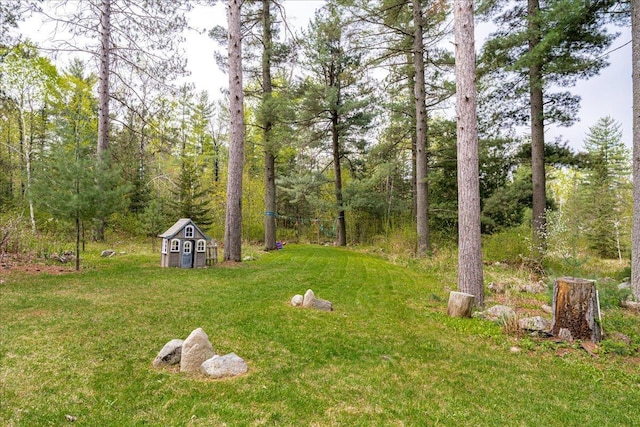 25 Maki Rd, Esko, MN 55733 - view of grassy yard with a shed and an outbuilding