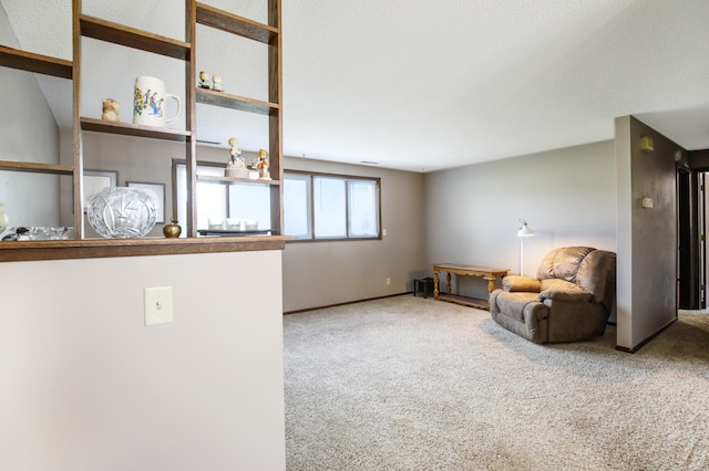 unfurnished room featuring carpet and baseboards