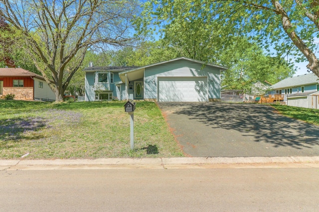 2515 Belmont Ln E, North Saint Paul, MN 55109 - view of front of home with asphalt driveway and an attached garage