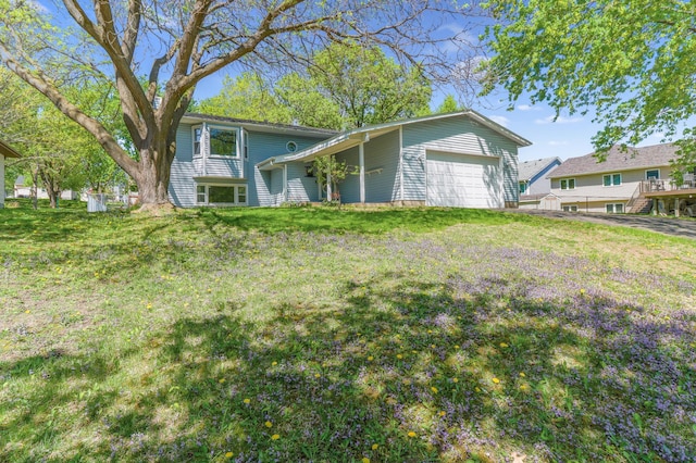 2515 Belmont Ln E, North Saint Paul, MN 55109 - view of front of house with a garage and a front lawn