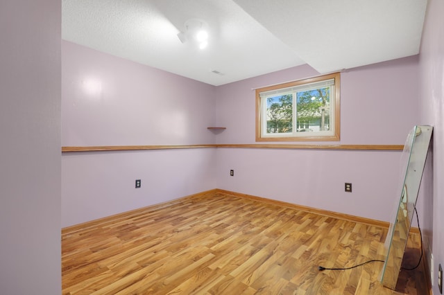 2515 Belmont Ln E, North Saint Paul, MN 55109 - empty room featuring wood finished floors and baseboards