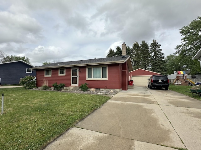 404 5th Ave NE, Kasson, MN 55944 - ranch-style house featuring an outbuilding, a detached garage, a chimney, a front lawn, and roof with shingles
