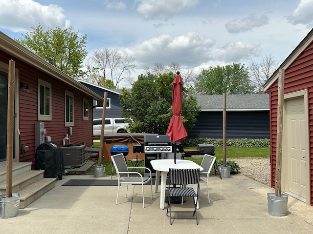 404 5th Ave NE, Kasson, MN 55944 - view of patio / terrace with outdoor dining space, central AC unit, and grilling area