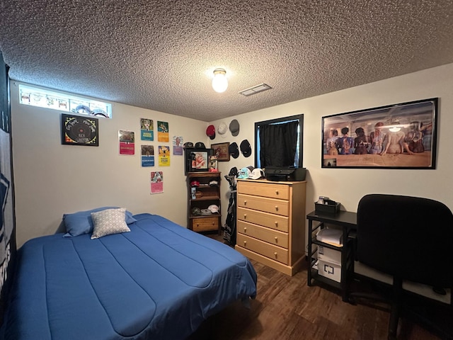 404 5th Ave NE, Kasson, MN 55944 - bedroom featuring dark wood finished floors and a textured ceiling