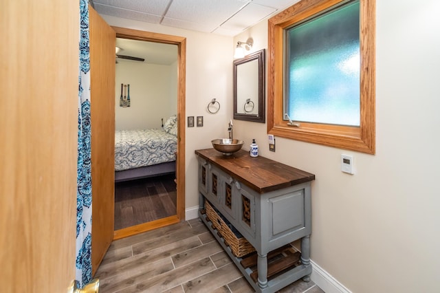 3010 Fairview Rd SW, Prior Lake, MN 55372 - bathroom with wood finished floors, baseboards, ensuite bathroom, and vanity