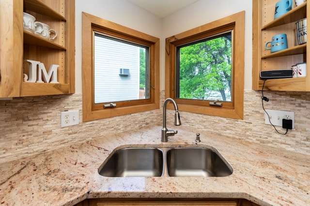3010 Fairview Rd SW, Prior Lake, MN 55372 - kitchen featuring a sink, open shelves, backsplash, and light stone counters