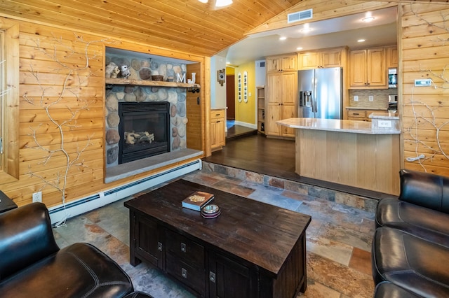 3010 Fairview Rd SW, Prior Lake, MN 55372 - living area featuring stone tile floors, lofted ceiling, a baseboard radiator, wood ceiling, and a stone fireplace