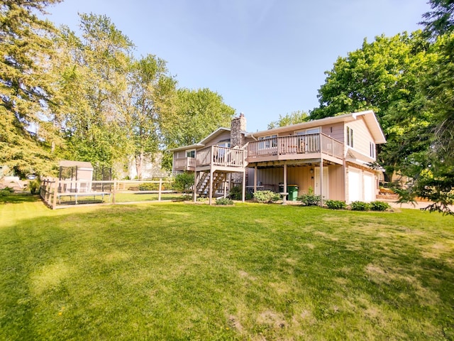 620 Maple St, Dassel, MN 55325 - back of property featuring a chimney, a deck, an attached garage, and stairway