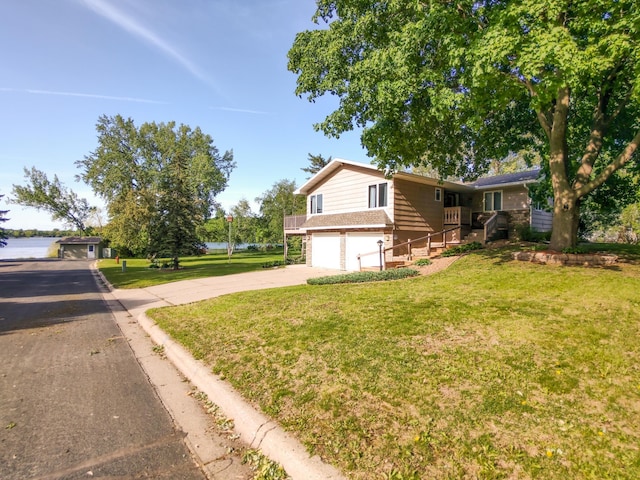 620 Maple St, Dassel, MN 55325 - view of front of house with an attached garage, a front yard, and driveway