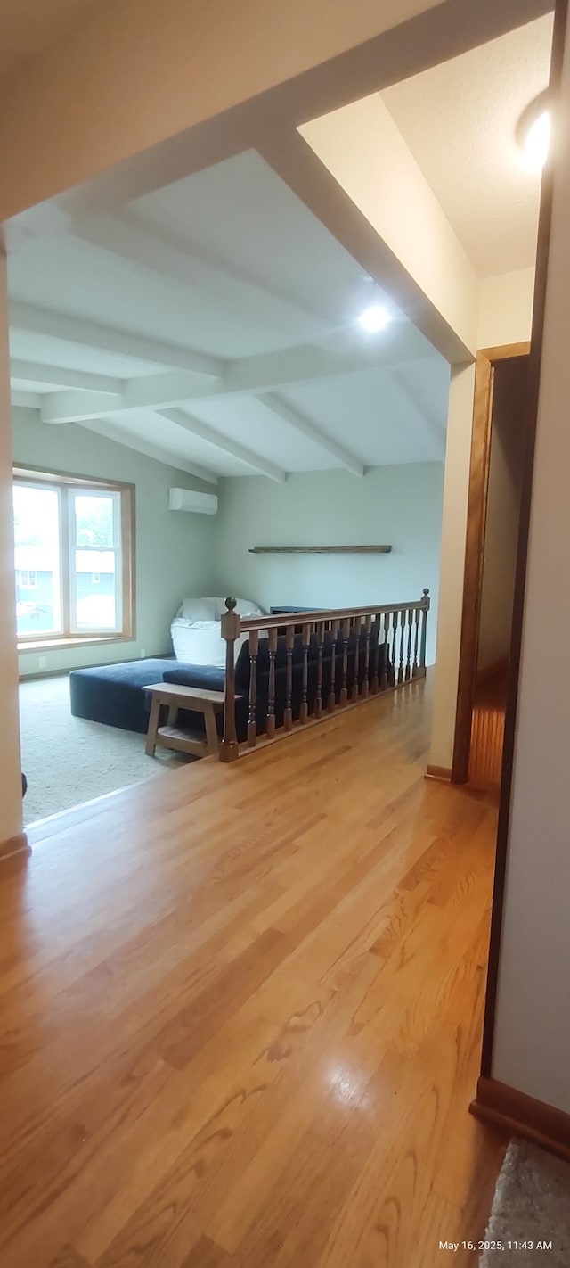 620 Maple St, Dassel, MN 55325 - additional living space with wood finished floors and an AC wall unit