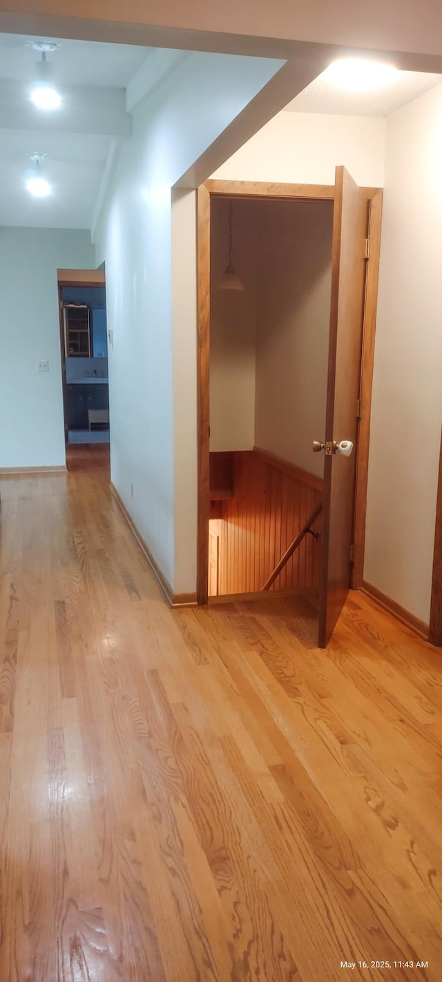 620 Maple St, Dassel, MN 55325 - hallway featuring light wood-style flooring, baseboards, and beam ceiling