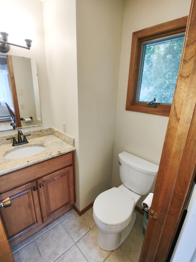 620 Maple St, Dassel, MN 55325 - bathroom with vanity, toilet, and tile patterned flooring