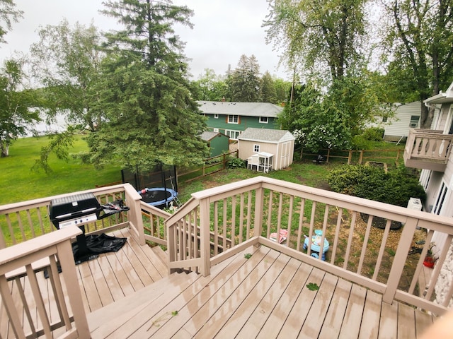620 Maple St, Dassel, MN 55325 - wooden deck featuring a trampoline and grilling area