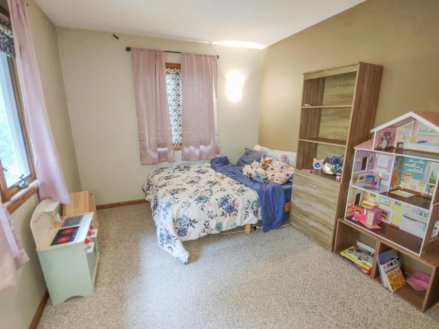 620 Maple St, Dassel, MN 55325 - carpeted bedroom featuring multiple windows and baseboards