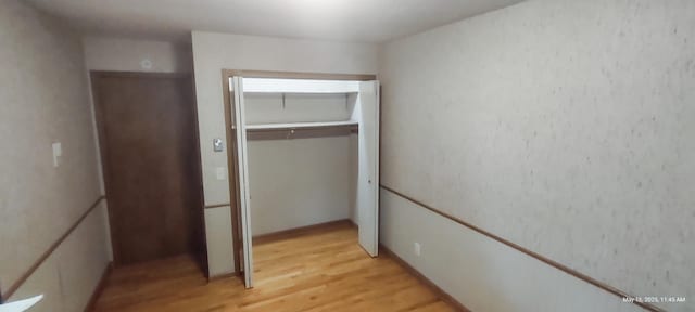 620 Maple St, Dassel, MN 55325 - unfurnished bedroom featuring light wood-style flooring and a closet