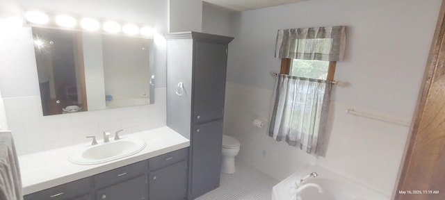 620 Maple St, Dassel, MN 55325 - bathroom featuring toilet, vanity, a bathtub, tasteful backsplash, and tile patterned floors