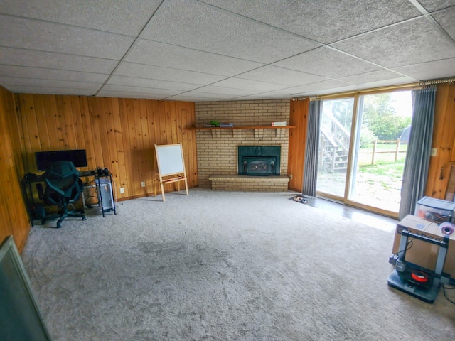 620 Maple St, Dassel, MN 55325 - unfurnished living room with carpet, wooden walls, and a fireplace