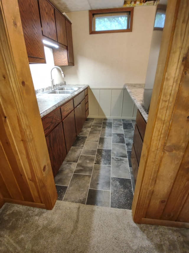 620 Maple St, Dassel, MN 55325 - kitchen featuring a sink, light countertops, and brown cabinets