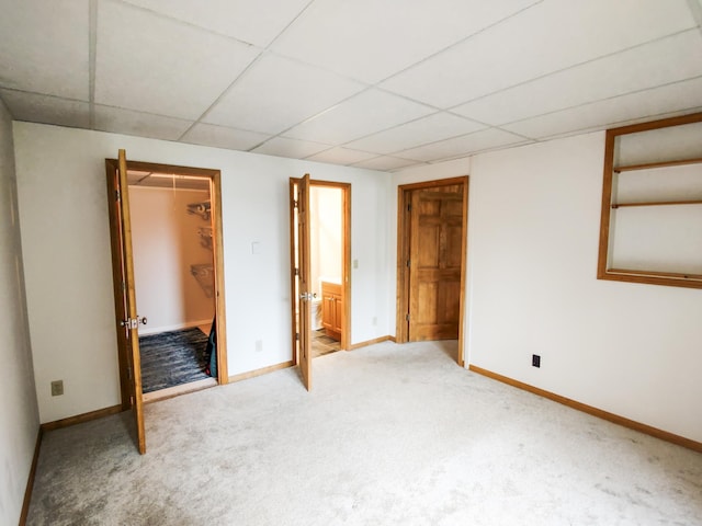 620 Maple St, Dassel, MN 55325 - unfurnished bedroom with a drop ceiling, baseboards, carpet, a spacious closet, and a closet