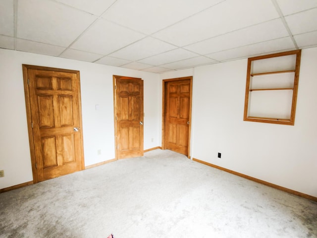620 Maple St, Dassel, MN 55325 - unfurnished bedroom featuring a drop ceiling, carpet flooring, and baseboards