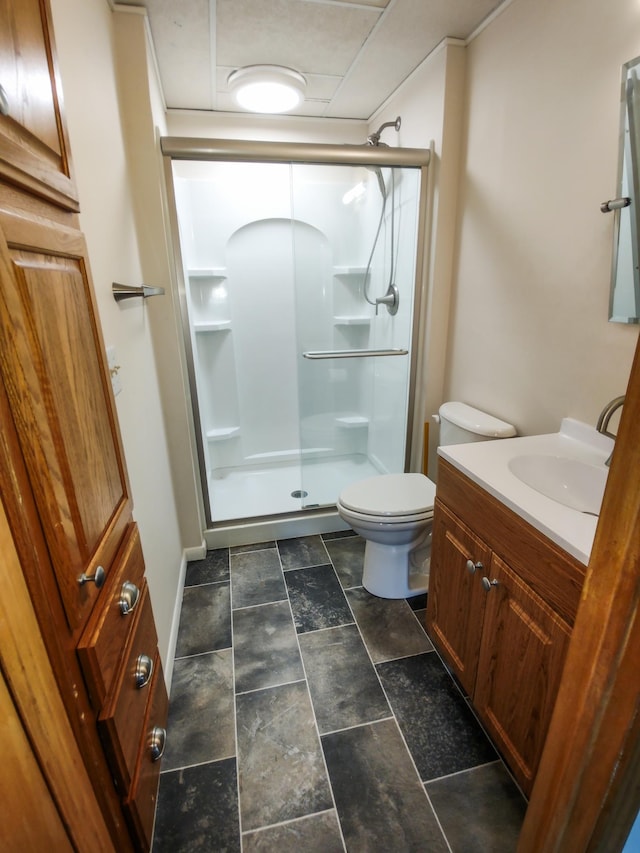 620 Maple St, Dassel, MN 55325 - bathroom featuring a stall shower, vanity, toilet, and stone finish floors