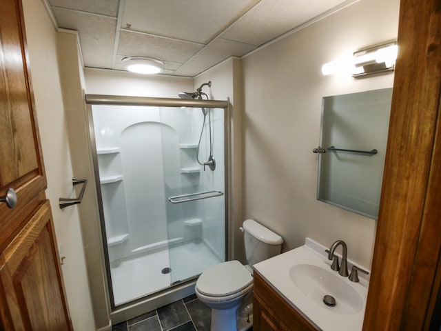 620 Maple St, Dassel, MN 55325 - full bathroom with a shower stall, toilet, vanity, a paneled ceiling, and tile patterned flooring