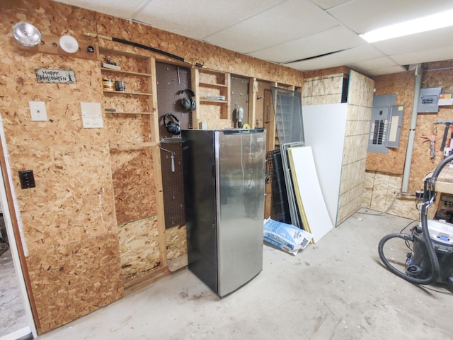 620 Maple St, Dassel, MN 55325 - below grade area featuring electric panel, freestanding refrigerator, and a paneled ceiling