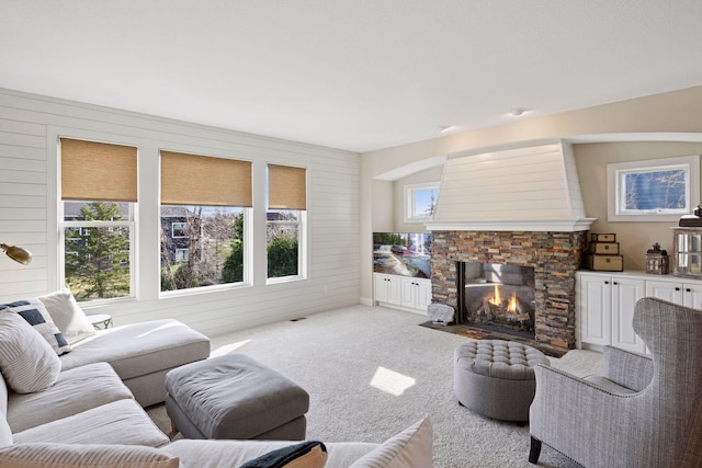 2971 Fairway Dr, Chaska, MN 55318 - living room featuring a stone fireplace, carpet floors, and wooden walls