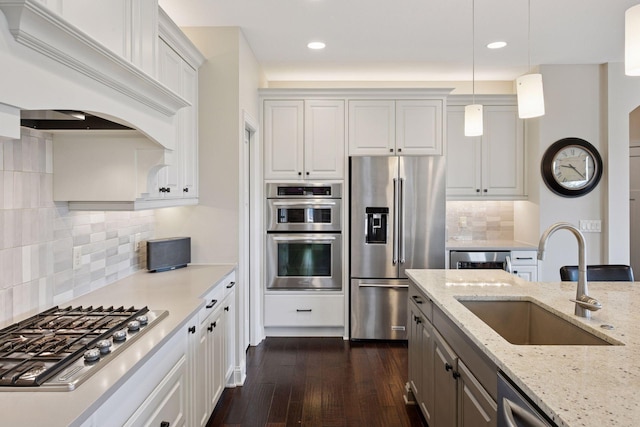 2971 Fairway Dr, Chaska, MN 55318 - kitchen with stainless steel appliances, custom range hood, a sink, dark wood-type flooring, and white cabinetry