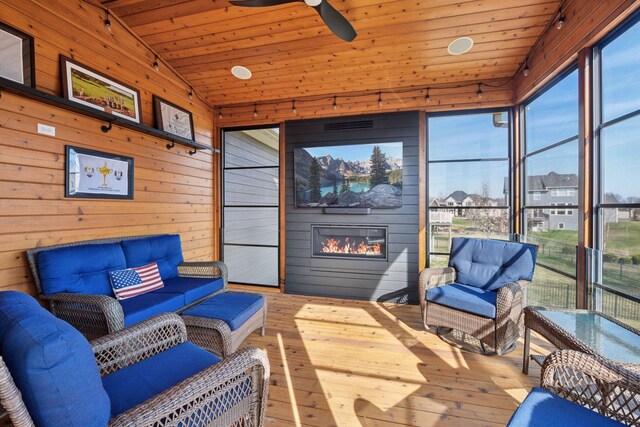 2971 Fairway Dr, Chaska, MN 55318 - sunroom featuring an outdoor living space with a fireplace, a ceiling fan, and vaulted ceiling