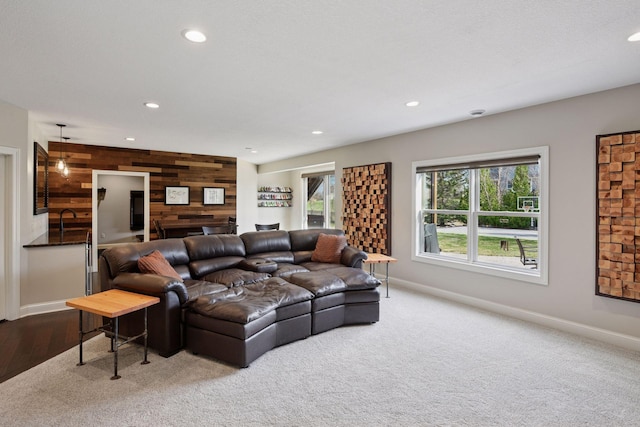 2971 Fairway Dr, Chaska, MN 55318 - carpeted living area with wooden walls, recessed lighting, baseboards, and an accent wall