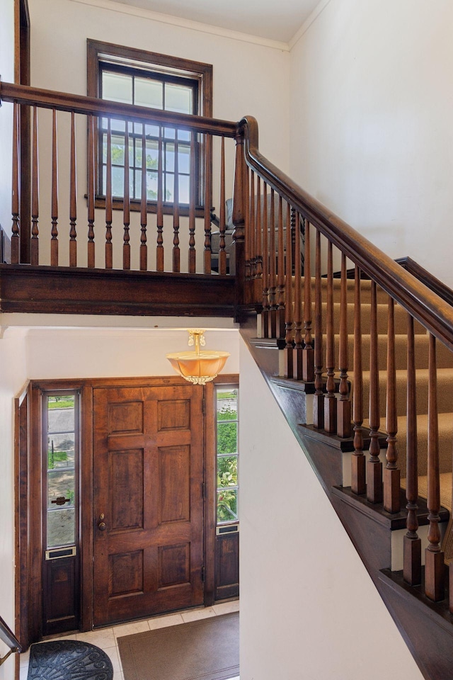 1785 Dupont Ave S, Minneapolis, MN 55403 - tiled foyer featuring stairway and ornamental molding