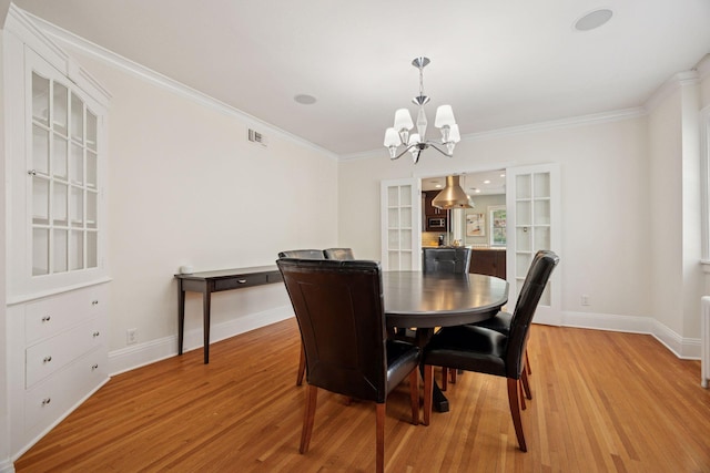 1785 Dupont Ave S, Minneapolis, MN 55403 - dining room with a chandelier, light wood-style flooring, baseboards, and ornamental molding
