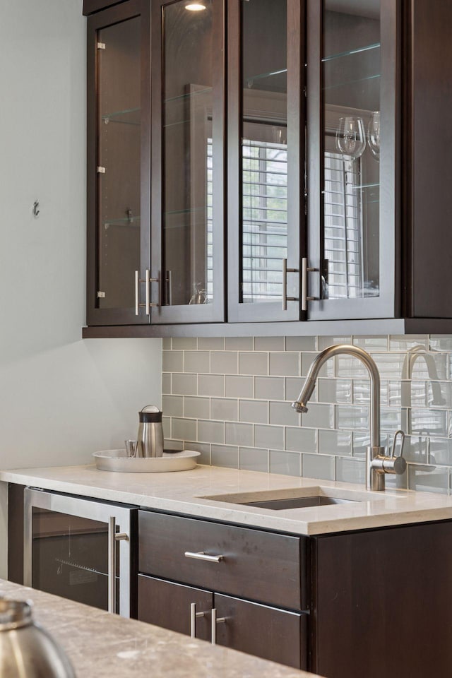 1785 Dupont Ave S, Minneapolis, MN 55403 - bar area with decorative backsplash, a sink, and beverage cooler