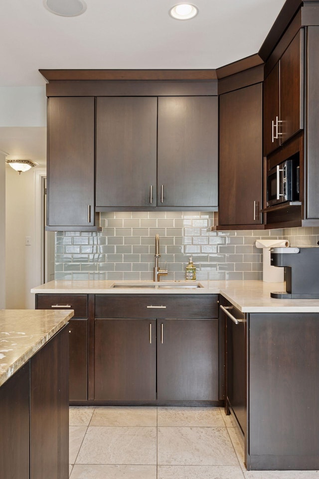 1785 Dupont Ave S, Minneapolis, MN 55403 - kitchen with a sink, dark brown cabinetry, decorative backsplash, light tile patterned floors, and recessed lighting