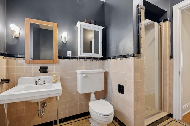 1785 Dupont Ave S, Minneapolis, MN 55403 - bathroom with toilet, a stall shower, tile walls, and wainscoting