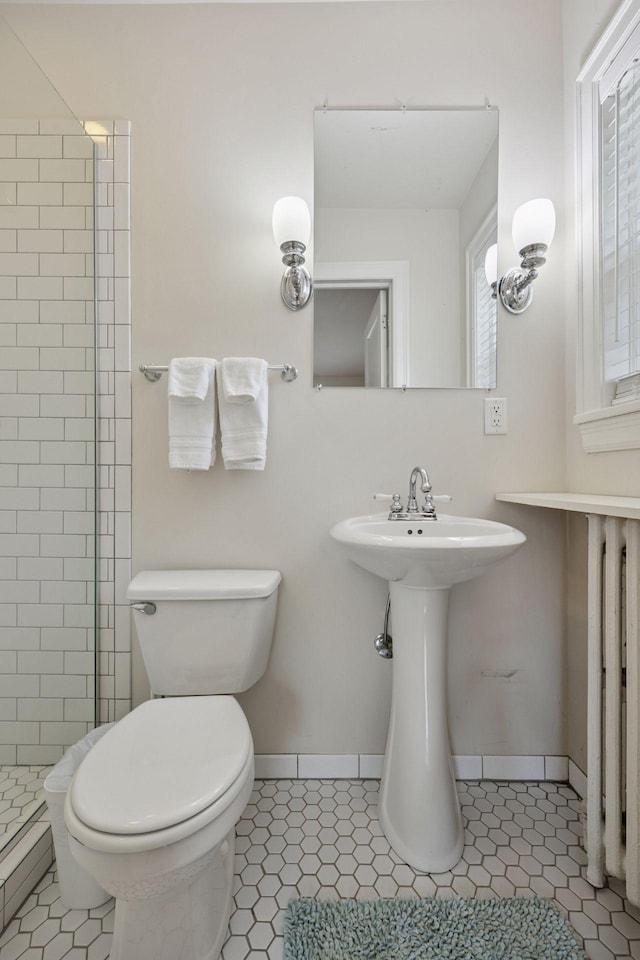 1785 Dupont Ave S, Minneapolis, MN 55403 - full bath featuring a shower stall, toilet, and tile patterned floors