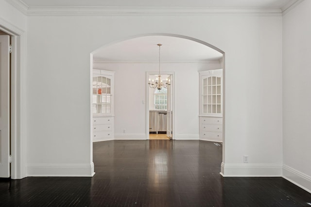 1785 Dupont Ave S, Minneapolis, MN 55403 - unfurnished dining area featuring arched walkways, wood finished floors, ornamental molding, baseboards, and a chandelier