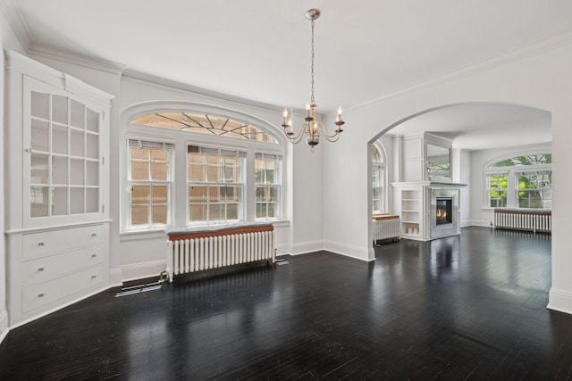 1785 Dupont Ave S, Minneapolis, MN 55403 - unfurnished living room with radiator, arched walkways, baseboards, a chandelier, and wood finished floors