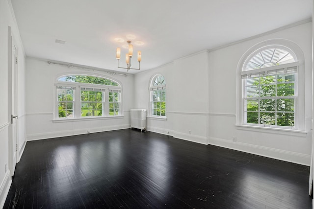 1785 Dupont Ave S, Minneapolis, MN 55403 - unfurnished room with a chandelier, baseboards, and dark wood-style flooring