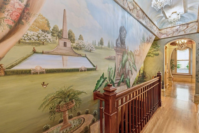 8 Grove St Unit 8B, Minneapolis, MN 55401 - corridor with a chandelier, arched walkways, and wood finished floors
