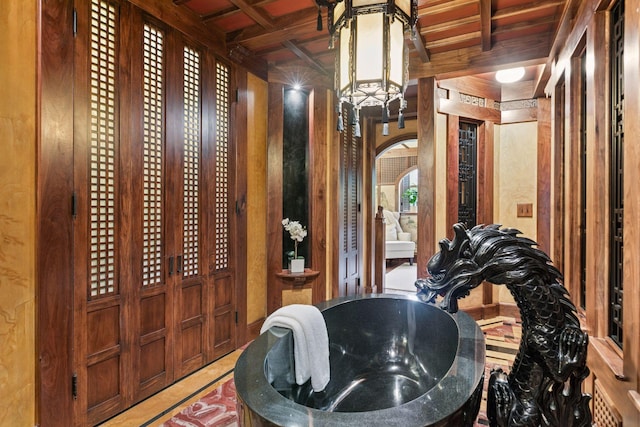 8 Grove St Unit 8B, Minneapolis, MN 55401 - bathroom with coffered ceiling, a chandelier, and beamed ceiling