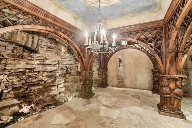 8 Grove St Unit 8B, Minneapolis, MN 55401 - wine cellar featuring arched walkways, stone flooring, a chandelier, and decorative columns