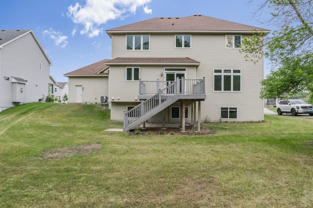 10543 Noble Cir N, Brooklyn Park, MN 55443 - back of property featuring stairs, roof with shingles, a yard, and a deck
