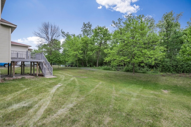 10543 Noble Cir N, Brooklyn Park, MN 55443 - view of green lawn featuring stairs and a deck