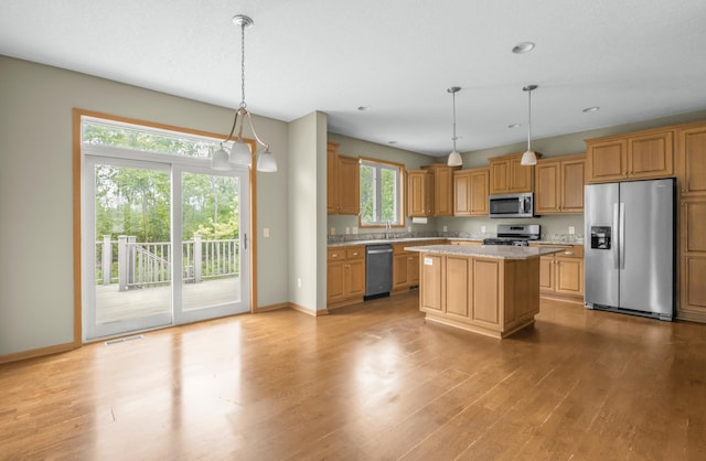 10543 Noble Cir N, Brooklyn Park, MN 55443 - kitchen featuring stainless steel appliances, healthy amount of natural light, light wood finished floors, baseboards, and recessed lighting